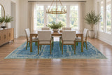 24624 Royal Vasighi blue rug staged beneath dining table and chairs